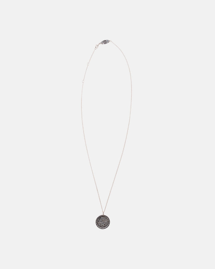 5 STARS NECKLACE - silver star medallion necklace, flat lay - Cold Culture