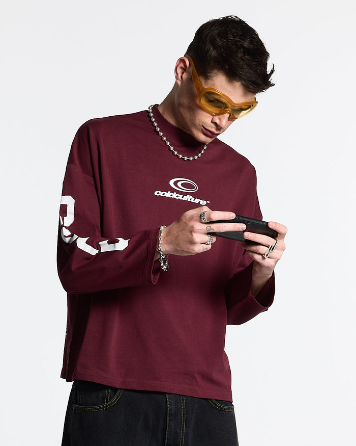55 FLAMES LONGSLEEVE BURGUNDY - burgundy graphic longsleeve tee, front view on male model - Cold Culture #man