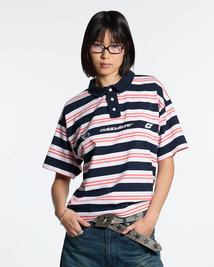 AEROSTRIPES POLO BLUE SEA/CORAL - navy and coral striped polo shirt, front view on female model - Cold Culture #woman