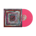 A pink vinyl record from Axis is partly visible beside its album cover, which displays textured concentric squares—a vibrant design that mirrors the powerful sound at the heart of this release.