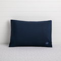 A navy-colored toddler pillow with a small logo on the bottom right corner, presented against a white background.