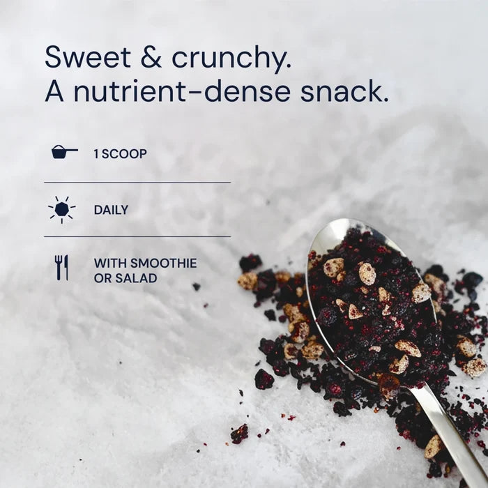 Spoonful of dark, crumbly snack with text about its nutritional benefits on a light background