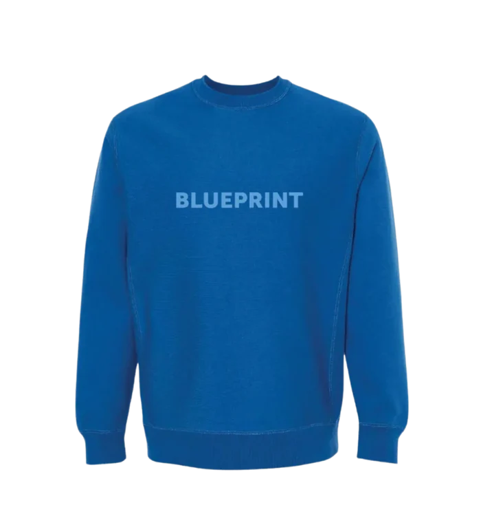 A blue crewneck sweatshirt with the word 'BLUEPRINT' printed across the front in capital letters