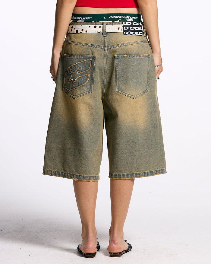 C V2 DIRTY DENIM SHORTS - washed denim shorts, back view on female model - Cold Culture #woman