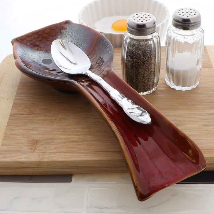 red ceramic spoon rest
