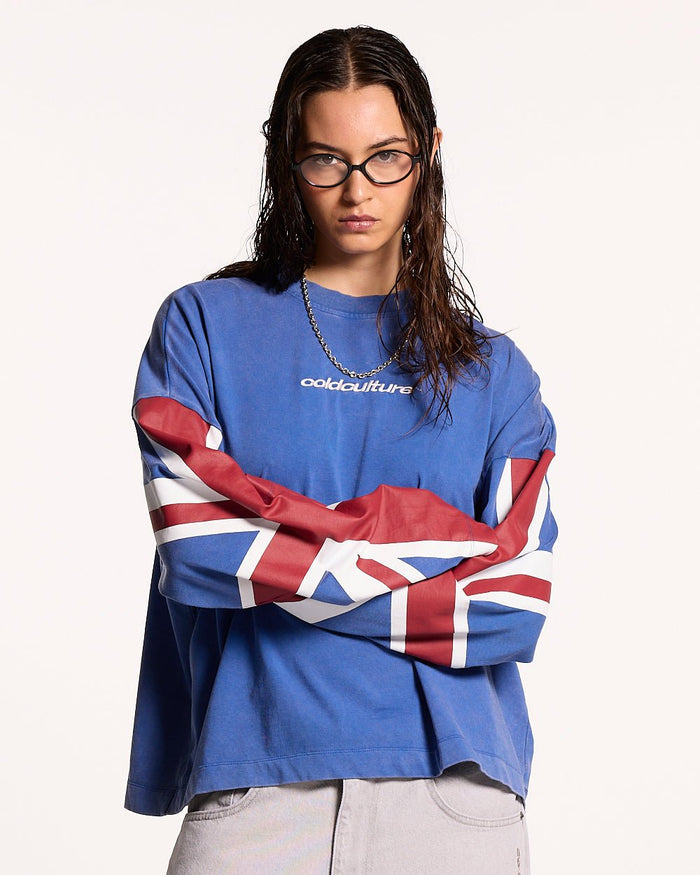 CHEERS LONGSLEEVE ROYAL - royal blue flag print longsleeve tee, front view on female model - Cold Culture #woman