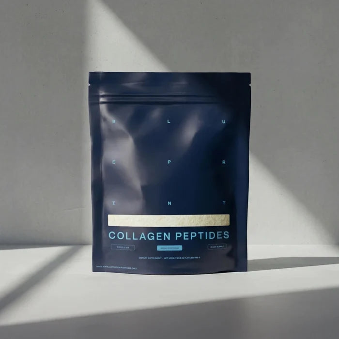 Dark blue package of collagen peptides on a gray background