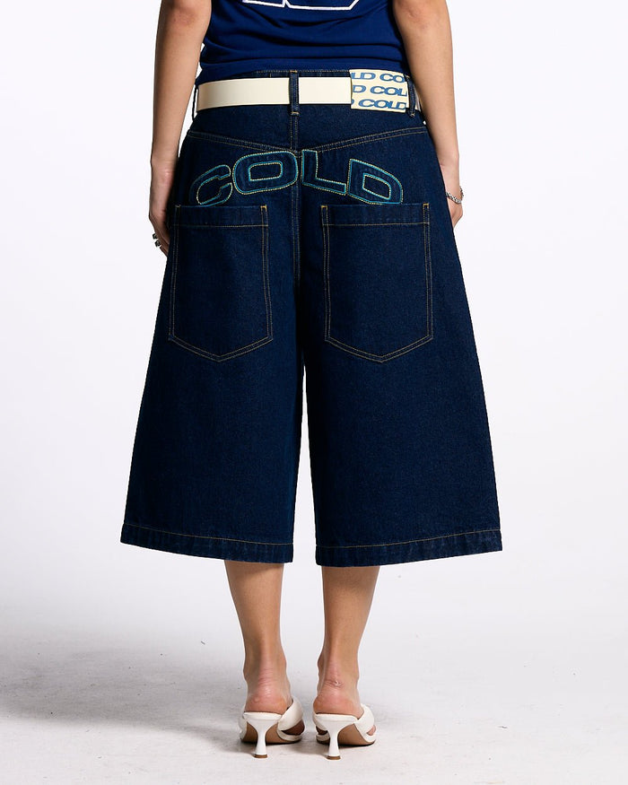 COWBOY SHORTS BLUE - dark blue denim shorts, back view on female model - Cold Culture #woman