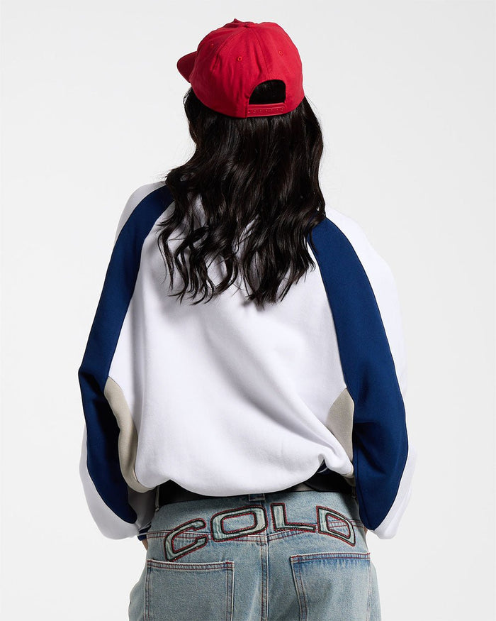 COWBOY VARSITY CREWNECK WHITE/BLUE - white and navy varsity crewneck sweatshirt, back view on female model - Cold Culture #woman