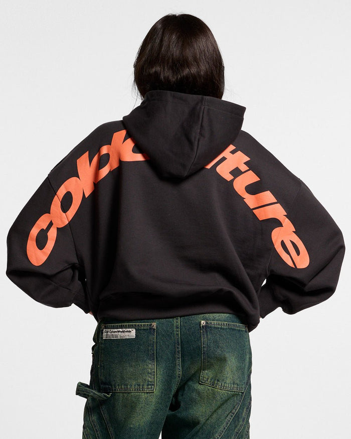 CURVED HOODIE BLACK - black logo print hoodie, back view on female model - Cold Culture #woman