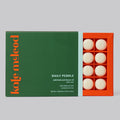 Kate McLeod Daily Pebble, a tray of twenty solid bath and shower oils