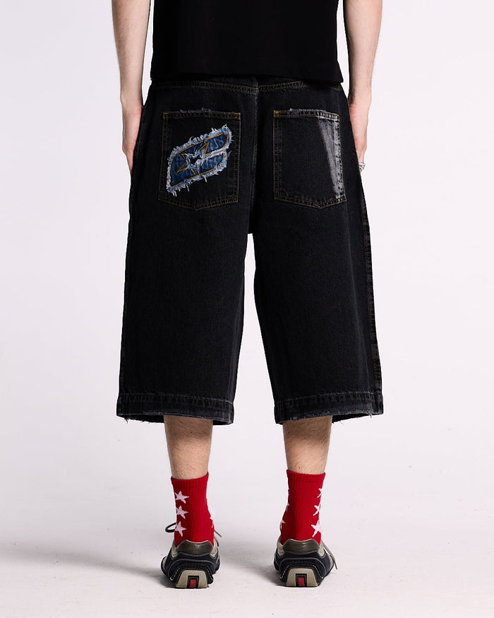 DARK SEA SHORT - baggy black denim shorts, back view on male model - Cold Culture #man