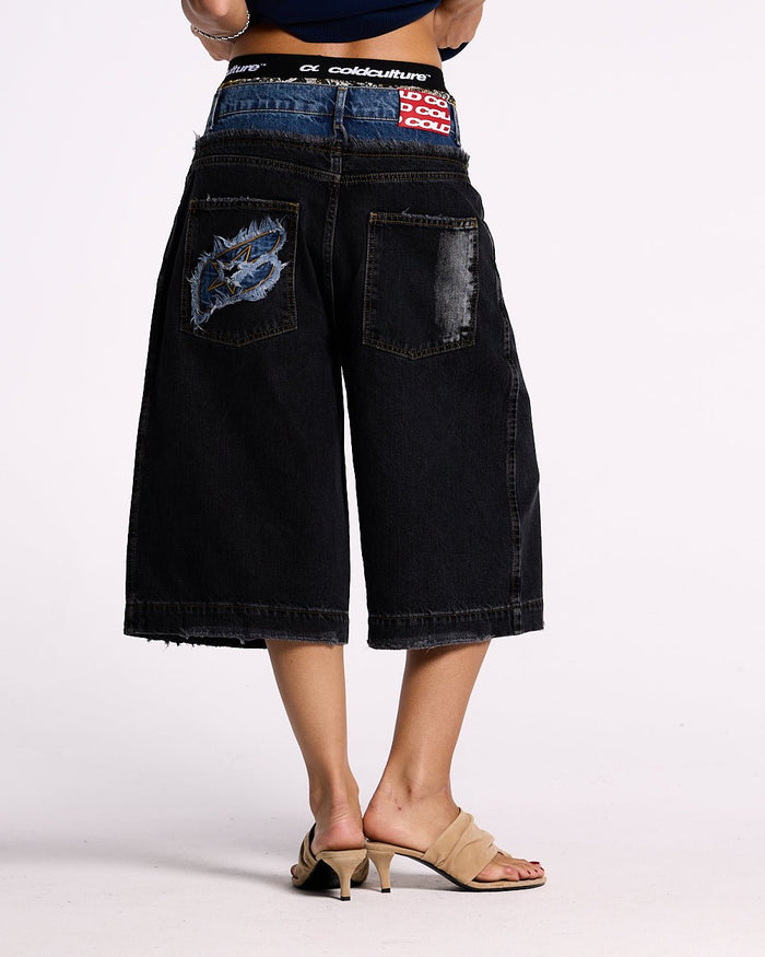 DARK SEA SHORT - baggy black denim shorts, back view on female model - Cold Culture #woman