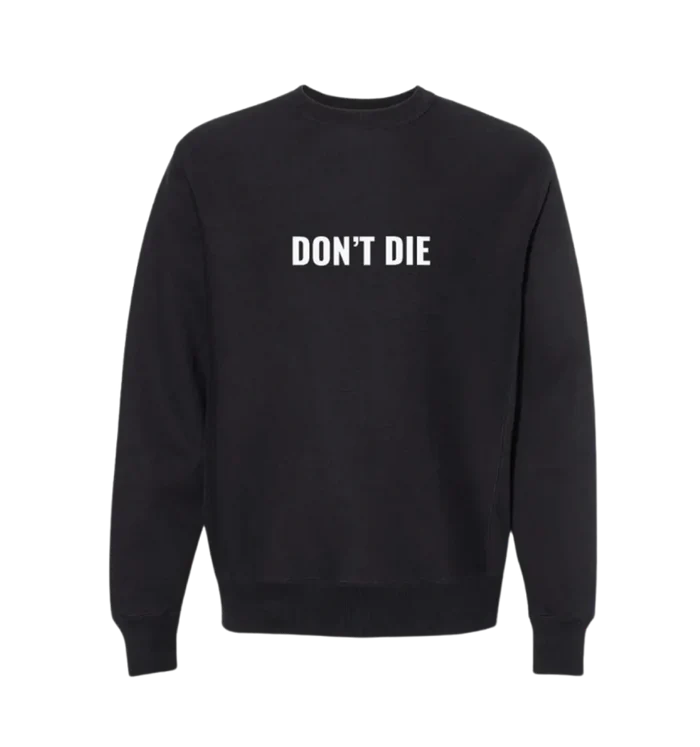 A black crewneck sweatshirt with the text 'DON'T DIE' written across the front in bold letters.