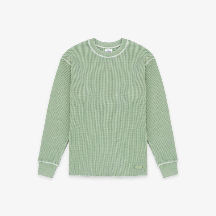 A sage green ribbed knit long-sleeve shirt with contrasting light green trim along the crew neck, shoulders, cuffs, and hem, displayed flat against a light gray background.