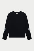 Black long sleeve t-shirt with white branding on sleeves against a light grey background