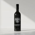 Black bottle of Snake Oil Blueprint on a white background #1-bottle