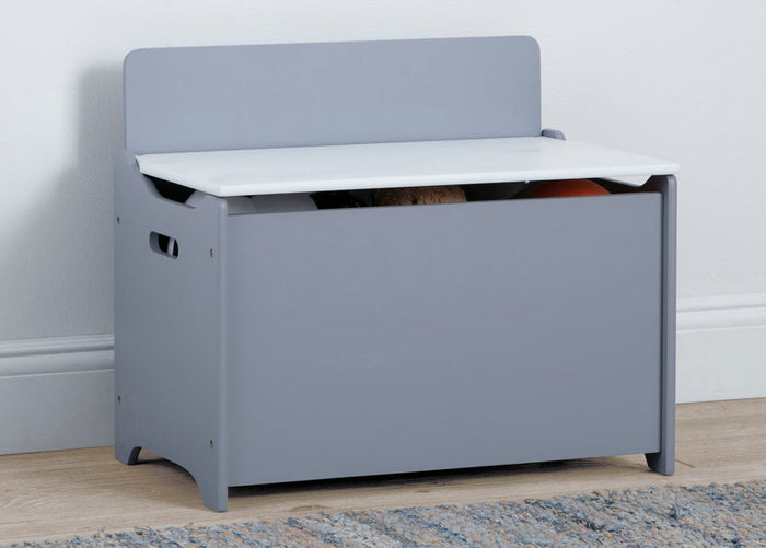 Gray toy storage bench with white top on a wooden floor.