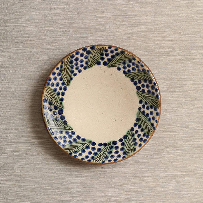 Hand painted plate with wreath decorated edge