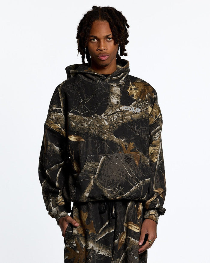 HOODIE REALTREE BLACK - black realtree camo hoodie, front view on male model - Cold Culture #man