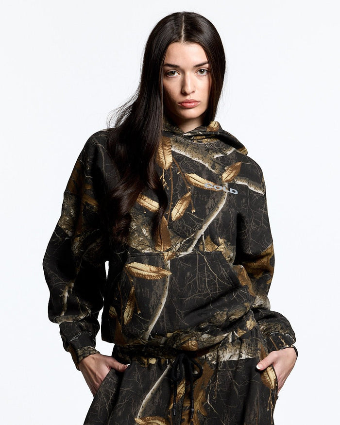HOODIE REALTREE BLACK - black realtree camo hoodie, front view on female model - Cold Culture #woman