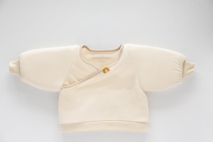 Coconut Cream Jacky swaddle transition jacket on a white background