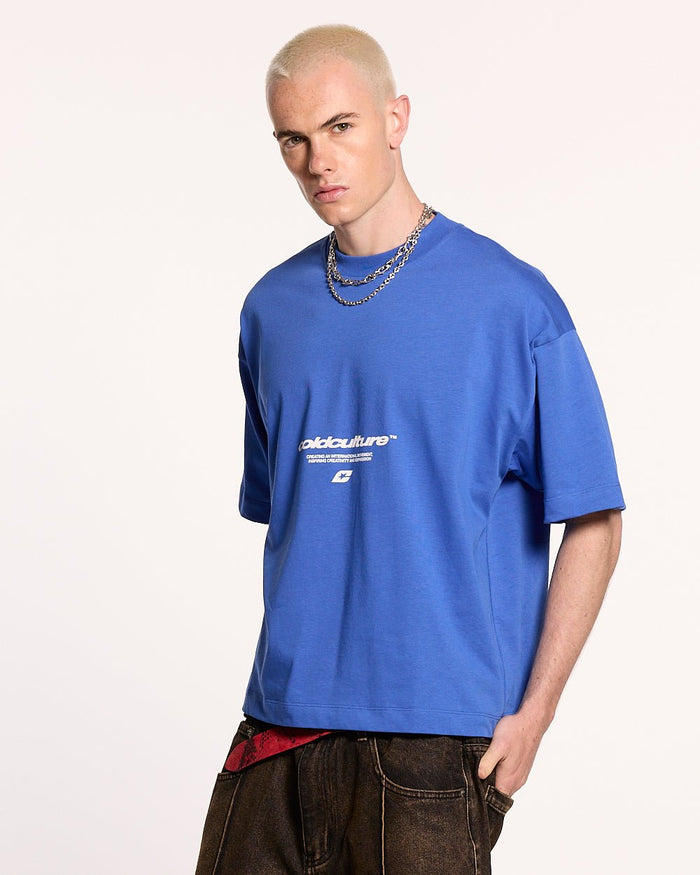 LET'S BOUNCE TEE BLUE - blue graphic print tee, front view on male model - Cold Culture #man