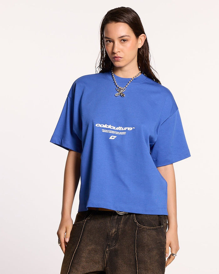 LET'S BOUNCE TEE BLUE - blue graphic print tee, front view on female model - Cold Culture #woman