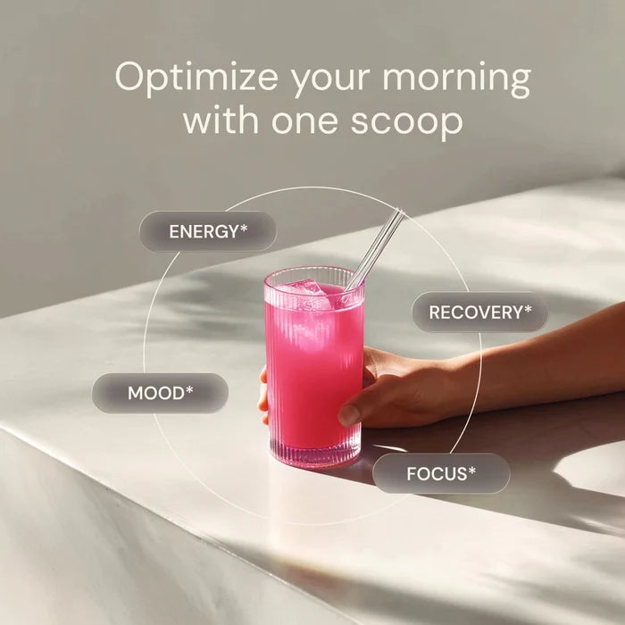 Hand holding a glass of pink drink with text about optimizing mornings and drink benefits.