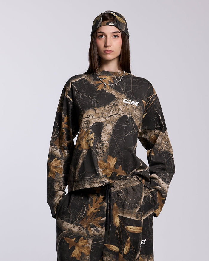 LONGSLEEVE REALTREE BLACK - black camo longsleeve tee, front view on female model - Cold Culture #woman