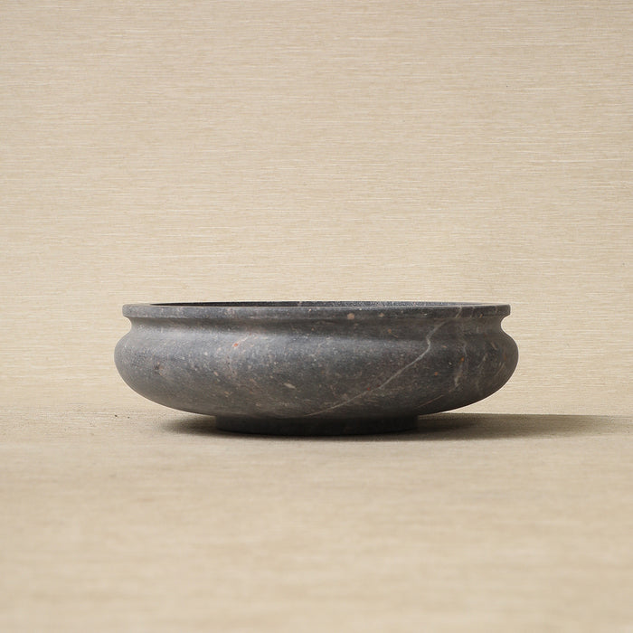 Low carved stone bowl