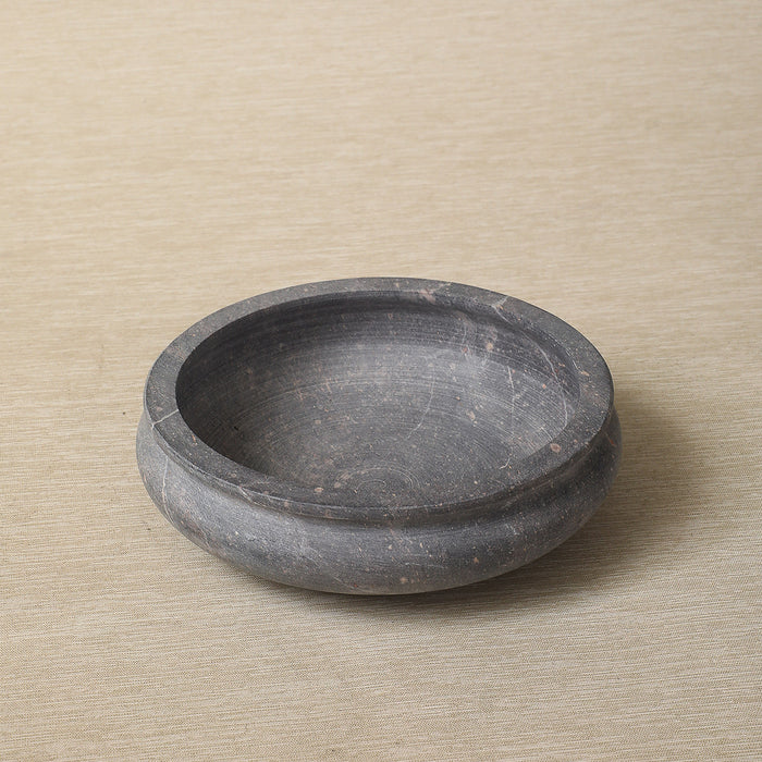 Low carved stone bowl