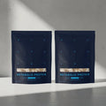 Two packages of Metabolic Protein on a gray surface with a light gray background #vanilla_30-day