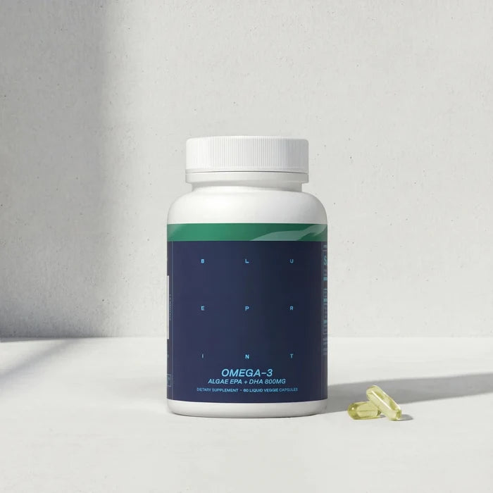 Omega-3 supplement bottle with capsules on a light gray background
