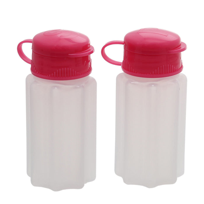 pink plastic salt and pepper shakers