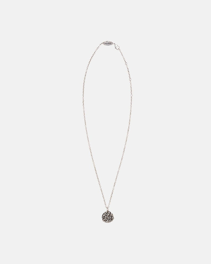 SAINT NECKLACE - silver saint medallion necklace, flat lay - Cold Culture
