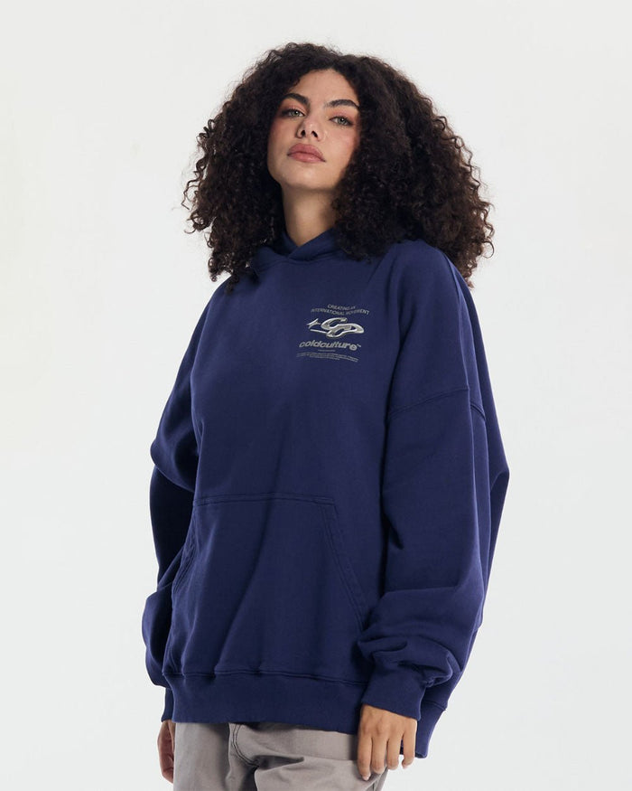 SPARKLY HOODIE COSMIC BLUE - navy blue oversized hoodie, front view on female model - Cold Culture #woman