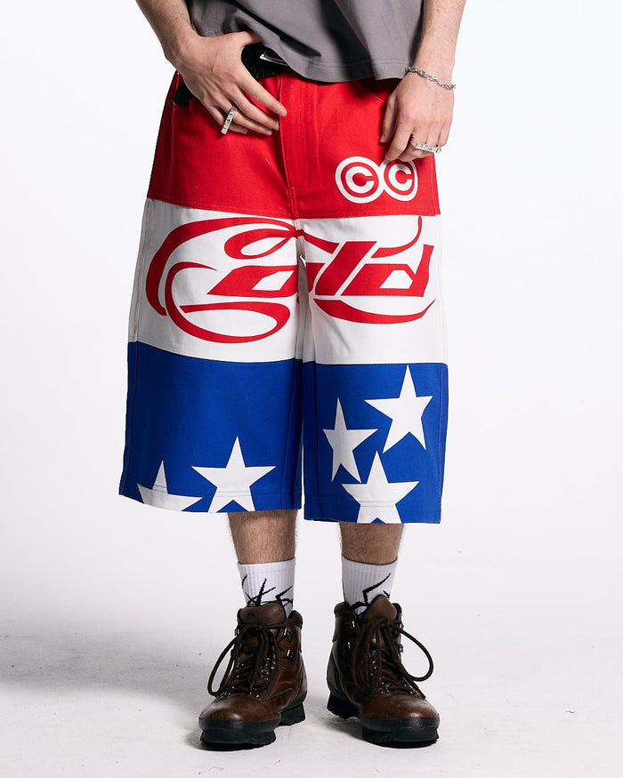 STARS JORTS RED WHITE AND BLUE - red white blue star print shorts, front view on male model - Cold Culture #man