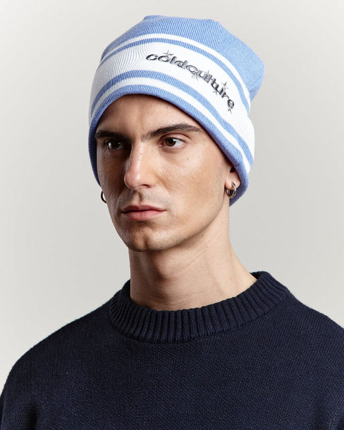 STARS STRAP BEANIE BLUE CALICO - blue striped knit beanie, front view on male model - Cold Culture