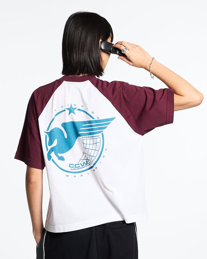 STORMWING TEE WHITE AND BURGUNDY - white and burgundy raglan tee, back view on female model - Cold Culture #woman